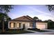 Single story home with an attached garage and neatly landscaped front yard at 11456 Libby Rd, Spring Hill, FL 34609