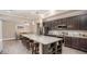 Open kitchen with a spacious island, stainless steel appliances, and elegant countertops at 11456 Libby Rd, Spring Hill, FL 34609