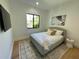 Cozy bedroom with a neutral color scheme, sleek window trim, and bright sunlight at 1409 S Moody Ave # 1, Tampa, FL 33629