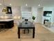 Open concept dining area adjacent to a modern kitchen, filled with natural light and neutral colors at 1409 S Moody Ave # 1, Tampa, FL 33629