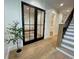 Inviting hallway leading to the office, stairs and a half bathroom at 1409 S Moody Ave # 1, Tampa, FL 33629