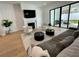 Bright and airy living room featuring a fireplace, sliding glass doors, and modern furnishings at 1409 S Moody Ave # 1, Tampa, FL 33629