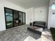 The patio features modular pavers, black frame sliding glass doors, and patio seating at 1409 S Moody Ave # 1, Tampa, FL 33629