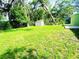 Spacious, green backyard with mature trees and a storage shed; ideal for outdoor enjoyment at 2731 Union S St, St Petersburg, FL 33712
