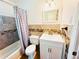 Well-lit bathroom featuring a shower-tub combination and a single sink vanity at 2731 Union S St, St Petersburg, FL 33712