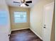 This bedroom has wood flooring, a window, a ceiling fan, and a neutral color palette at 2731 Union S St, St Petersburg, FL 33712