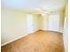 This cozy bedroom offers tile flooring, a ceiling fan, and a closet for ample storage at 2731 Union S St, St Petersburg, FL 33712