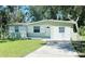 Charming single-story home with fresh paint, tidy landscaping, and a concrete driveway at 2731 Union S St, St Petersburg, FL 33712