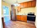 Functional kitchen with stainless steel appliances, wood cabinets, and eat-in bar at 2731 Union S St, St Petersburg, FL 33712
