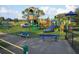 This outdoor playground has a variety of colorful slides, climbing structures, and seating areas at 2731 Union S St, St Petersburg, FL 33712