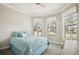 Serene bedroom with a comfortable bed and soft lighting, offering a peaceful retreat for relaxation at 13084 Rinella St, Venice, FL 34293