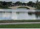 Bridge over a calm lake, with green landscaping on either side at 13084 Rinella St, Venice, FL 34293