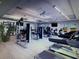 Spacious gym with various exercise machines including treadmills, stationary bikes, and weightlifting equipment at 13084 Rinella St, Venice, FL 34293