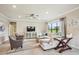 Bright and airy living room with elegant furnishings, a modern TV, and a decorative rug, creating a welcoming space at 13084 Rinella St, Venice, FL 34293