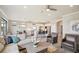 Bright and open-concept living space that seamlessly blends the kitchen, dining area, and living room for comfortable living at 13084 Rinella St, Venice, FL 34293