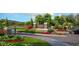 Stone monument sign reading 'West Hill' set amongst lush landscaping and colorful flowers at 14215 Suwannee Lake Dr, Dade City, FL 33525