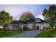 New construction gray home featuring stone accents, professional landscaping, and a paver driveway at 5008 Sea Branch Ave, Apollo Beach, FL 33572