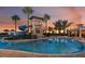 Enjoy the community pool with water slide, cabana and surrounding palm trees at 5008 Sea Branch Ave, Apollo Beach, FL 33572