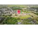 Aerial view of the community showcasing the neighborhood layout, green spaces, and nearby lake at 11402 Peckham Pl, Tampa, FL 33625