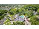 Community clubhouse and pool area surrounded by lush greenery and views of the nearby lake at 11402 Peckham Pl, Tampa, FL 33625