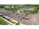 Aerial view of the home's rear featuring a screened enclosure and fenced yard at 11402 Peckham Pl, Tampa, FL 33625