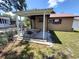 Outdoor patio area with a covered pergola and dining furniture, great for entertaining guests at 13 Euclid Dr, Plant City, FL 33563