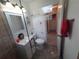 Bathroom features tiled glass shower, single vanity and new fixtures at 13 Euclid Dr, Plant City, FL 33563