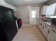Kitchen with granite countertops, stainless sink, and a view to the backyard at 13 Euclid Dr, Plant City, FL 33563