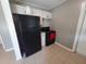 Kitchen features appliances, white cabinets and tiled floors at 13 Euclid Dr, Plant City, FL 33563