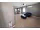Bright living room with a leather armchair and ottoman, showcasing a clean and modern design at 13 Euclid Dr, Plant City, FL 33563