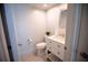 Clean and tidy half bathroom with a white vanity, modern fixtures, and neutral tones at 4203 Fairway Run, Tampa, FL 33618