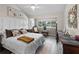 Comfortable bedroom with a large window, natural light, and neutral colors at 4203 Fairway Run, Tampa, FL 33618