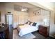 Bright bedroom with white walls, ceiling fan, closet and queen bed with modern decor and an ensuite bathroom at 4203 Fairway Run, Tampa, FL 33618