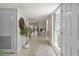 Bright and airy entryway with tile flooring, a decorative plant, and a textured glass window at 4203 Fairway Run, Tampa, FL 33618
