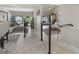 Open-concept living space featuring modern railings, tile flooring, and views of the outdoor patio at 4203 Fairway Run, Tampa, FL 33618