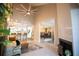 Bright living room features high ceilings, a ceiling fan, neutral decor, and flows into the dining room at 4203 Fairway Run, Tampa, FL 33618