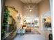 Bright living room features high ceilings, ceiling fan, neutral decor, and flows into the open kitchen with bar seating at 4203 Fairway Run, Tampa, FL 33618