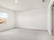 Clean and bright bedroom with plush carpeting and a large window providing natural light at 1844 Brekey Way, Zephyrhills, FL 33541