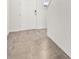 Entrance hallway featuring neutral tile flooring, leading to a door and onward, creating an inviting space at 1844 Brekey Way, Zephyrhills, FL 33541