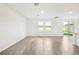 Large living room featuring sliding doors to backyard and tile flooring at 1844 Brekey Way, Zephyrhills, FL 33541