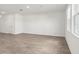Spacious living room with a neutral color palette and tile flooring at 1844 Brekey Way, Zephyrhills, FL 33541