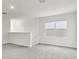 Upstairs living space with plush carpeting, great natural light, and freshly painted white walls at 1844 Brekey Way, Zephyrhills, FL 33541