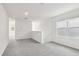 Upstairs living space featuring plush carpeting, and large windows that provide ample natural light at 1844 Brekey Way, Zephyrhills, FL 33541