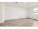 Living space featuring tile flooring, bright light, and freshly painted white walls at 1844 Brekey Way, Zephyrhills, FL 33541