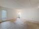 Spacious bedroom with plush carpeting and abundant natural light from multiple large windows at 1200 Tarpon Woods Blvd # L4, Palm Harbor, FL 34685