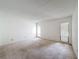 Bright bedroom with neutral carpet, vertical blinds and fresh white walls, a blank canvas at 1200 Tarpon Woods Blvd # L4, Palm Harbor, FL 34685