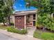 Inviting condo exterior with mature landscaping and a private entrance, unit 4 at 1200 Tarpon Woods Blvd # L4, Palm Harbor, FL 34685