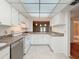 Spacious kitchen with ample cabinet space and updated appliances, adjacent to the living area at 1200 Tarpon Woods Blvd # L4, Palm Harbor, FL 34685