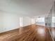 Spacious living room with hardwood floors and an open layout, leading to the kitchen area at 1200 Tarpon Woods Blvd # L4, Palm Harbor, FL 34685