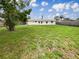 Expansive backyard with lush green grass, offering plenty of space for outdoor activities at 5629 Nutmeg Ave, Sarasota, FL 34231